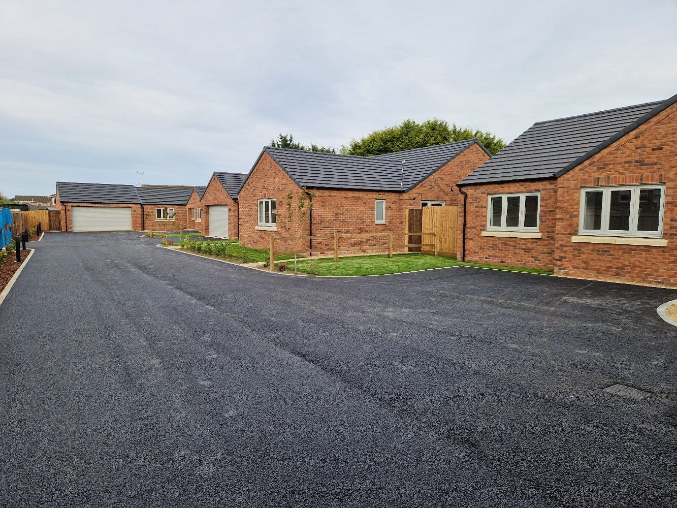 Freshly laid tarmac driveway serving a new-build bungalow development | driveways in King's Lynn by Humphries Construction